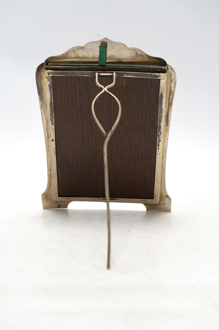 An early 20th century Chinese plain white metal mounted photograph frame, by Wang Hing, 18.7cm. Condition - fair